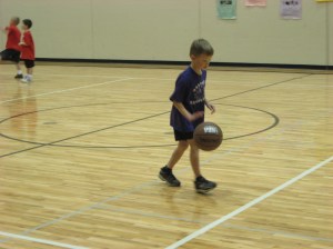 boy dribbling ball